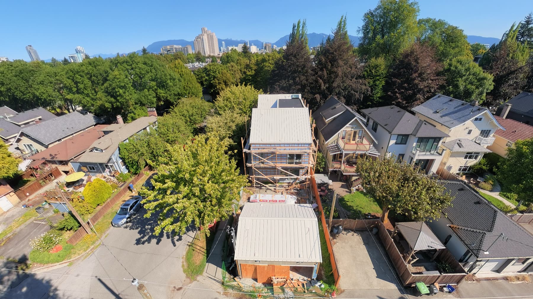 Aerial view of the Vancouver Net Zero residence and North Shore mountains